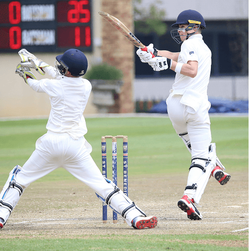Batsman driving through covers